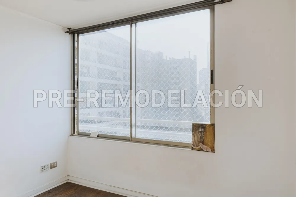 Dormitorio con vista a la ciudad, departamento San Isidro 538